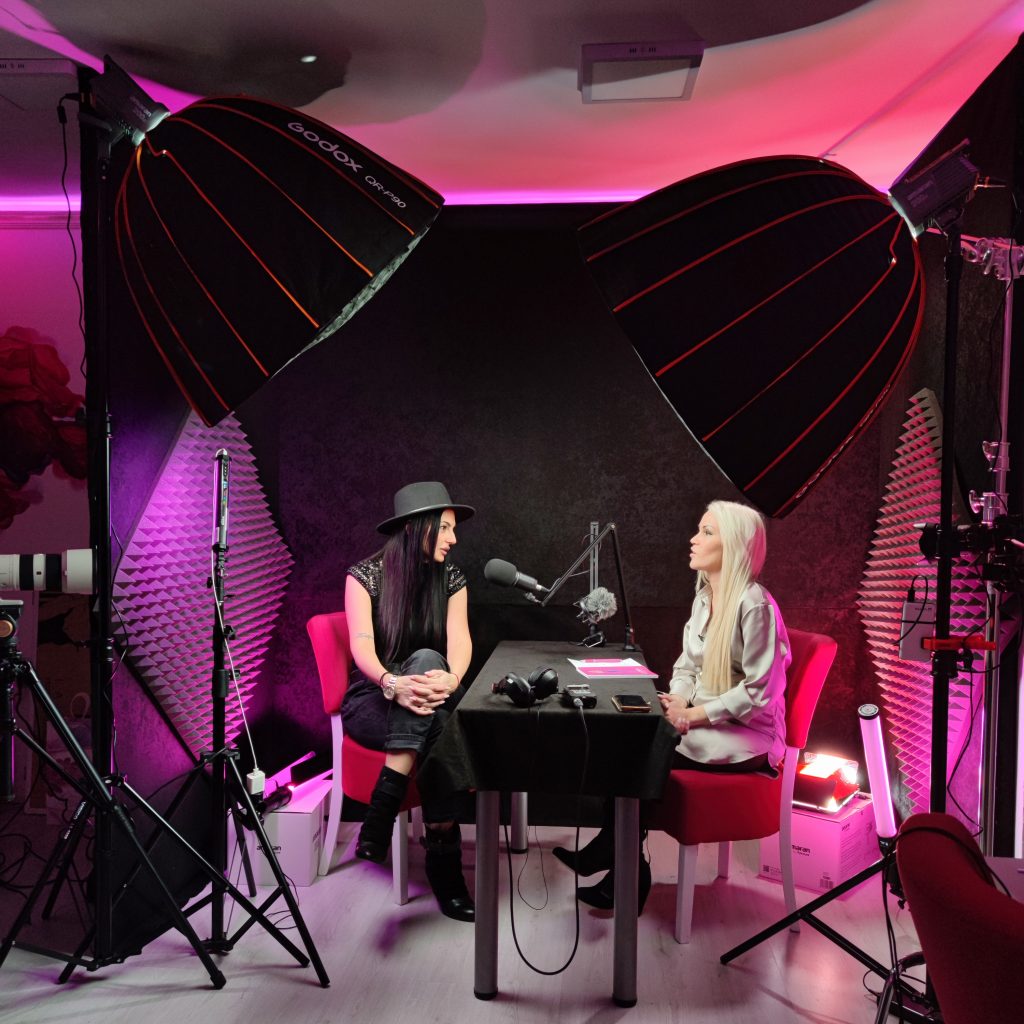 Podcast studio set with two microphones and softbox lighting